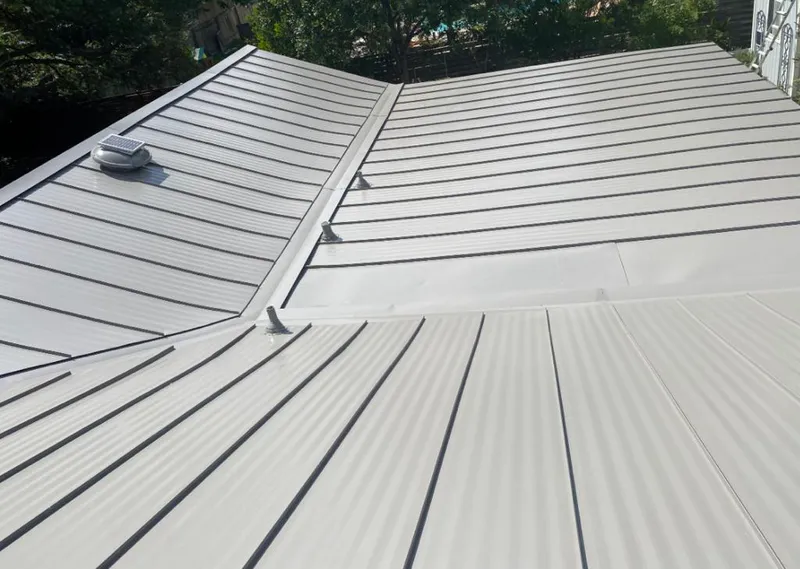 Solar attic fan installed on a metal roof for Roof Ventilation in East Palo Alto